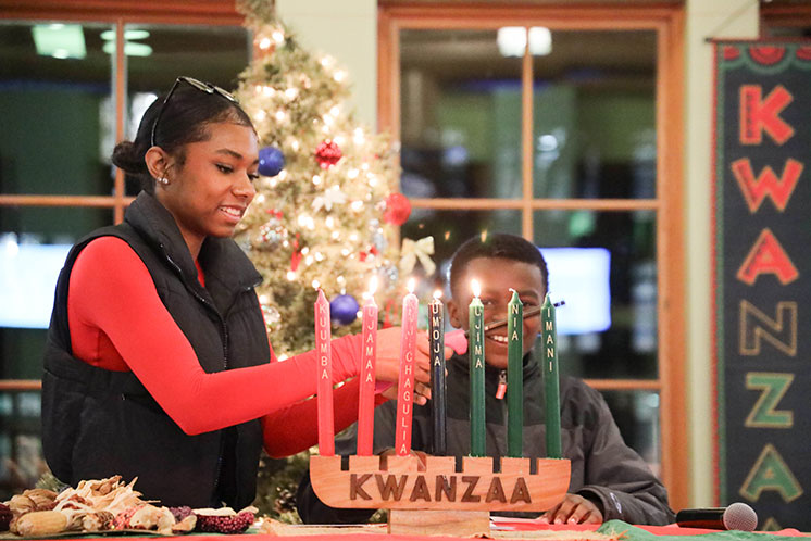 A student lights candles on the Kinara. Links to Gifts of Appreciated Securities A student lights candles on the Kinara. Links to Gifts of Appreciated Securities