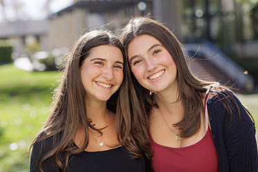 Two students smile together. Links to Gifts of Life Insurance Two students smile together. Links to Gifts of Life Insurance